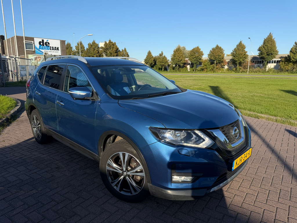 Zijkant blauwe Nissan X-Trail 2.0 AWD occasion